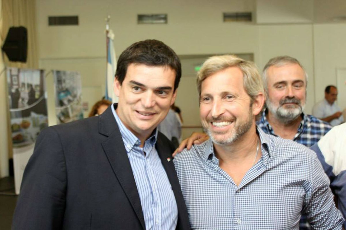 Cavagna junto al ministro Frigerio.